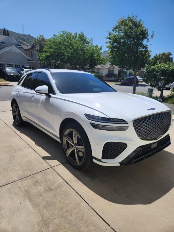 White Genesis GV70 detailed with a crisp reflective finish