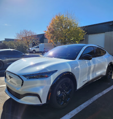 White Ford Mustang Mach-E with a high-gloss detailed finish