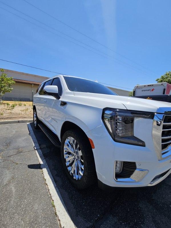 White GMC Yukon Denali detailed with a deep gloss finish