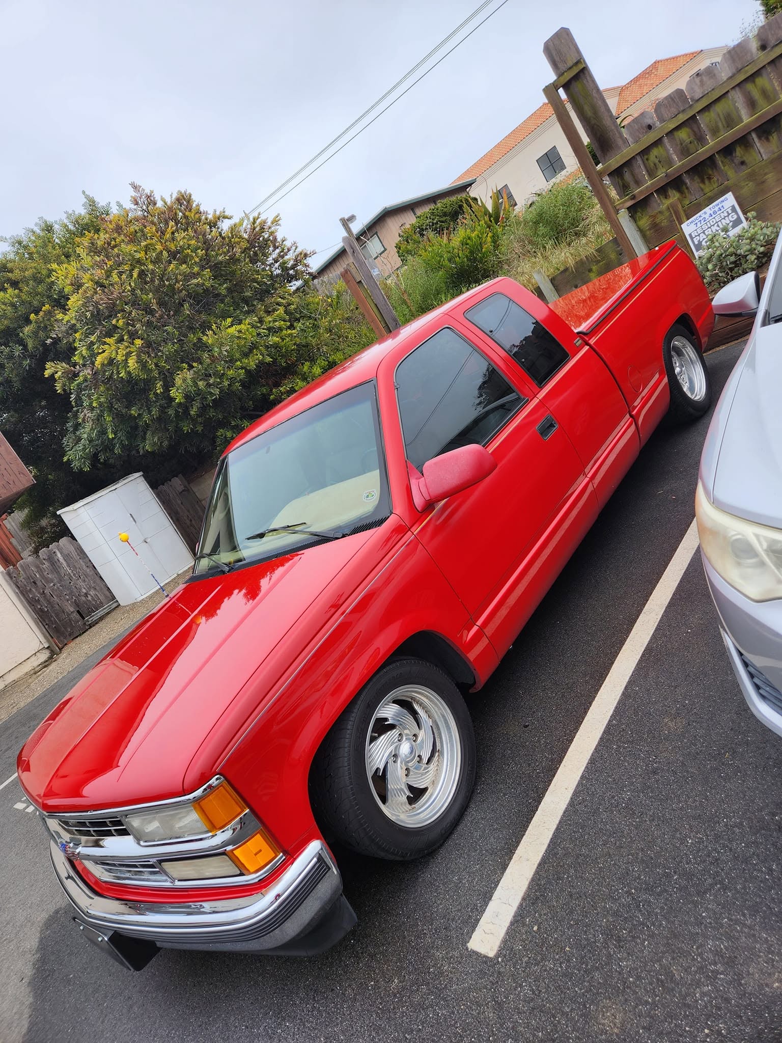 Red Dodge Ram pickup truck detailed and gleaming in the sun