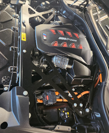 Cleaned and dressed engine bay after an engine detail service