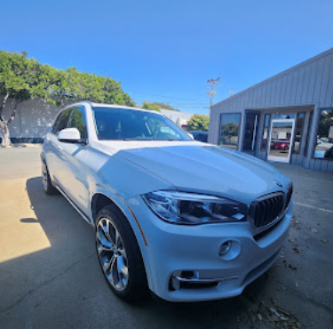 Light blue BMW X5 detailed and gleaming after a wash and seal