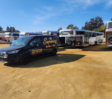 Mobile detailing van working a job with horse trailers on site
